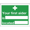 Safety Sign Your First Aider Is 150x200mm Self-Adhesive E42A/S